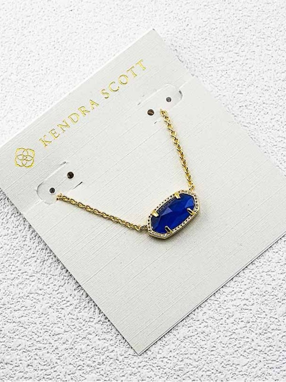 Kendra Scott Gold Necklace with Deep Blue Stone